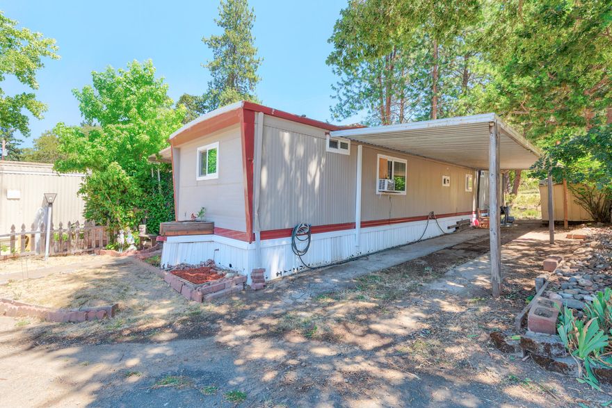 Beautiful mountain views from the back and front of this solid 3-bedroom 1.5-bath mobile in all-ages and pet-friendly mobile park. Newer Daikin ductless heat/air installed fall 2024.  Newer laminate dark wood-like floor could make a comfortable home. Rainfall shower head and beautiful circular vessel basin adorn the main bath. Added laundry room and work room. Seller states mobile park is quite and safe. Come see.