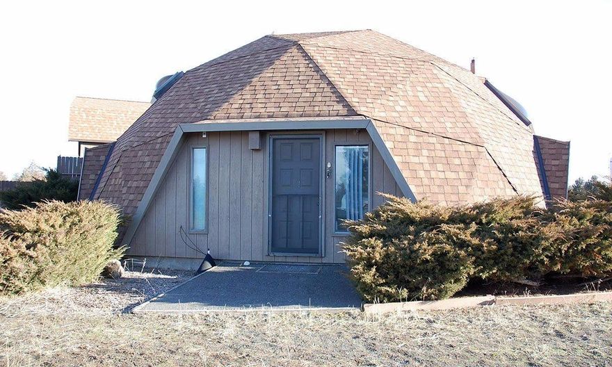 Unique opportunity to own this efficient Biodome home located on over 2.5 acres between Sister's & Bend! Potential abounds! Huge detached garage/shop with full bath power & tons of storage! You won't find anything like this for the price! The right buyer can bring this property back to it's full glory! Great investment!
