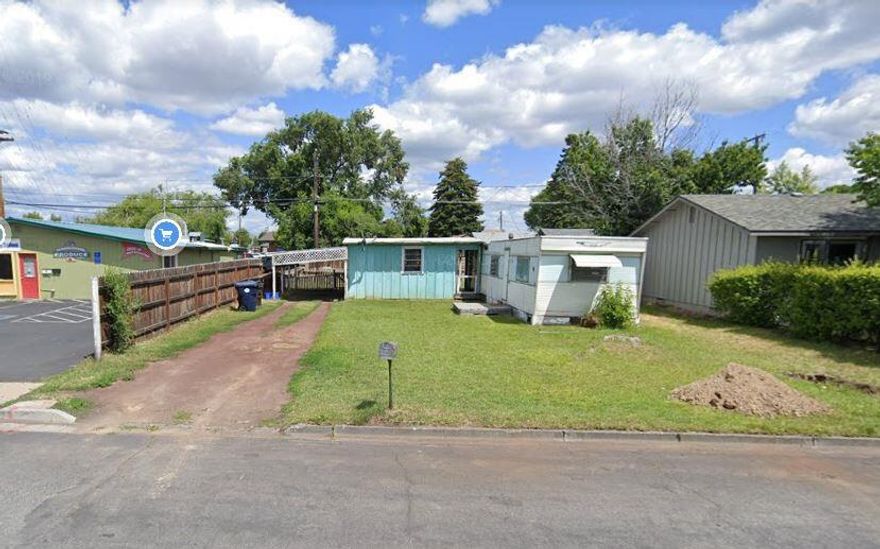 Small commercial lot with excellent access to Highland Ave. Near shopping, restaurants and other services. Ideal for professional office development. Sale include an older single wide and shed roof storage building. Mobile is in as-is condition and removal is recommended. C4 zoning includes various commercial uses, multi family, medical and mixed uses.