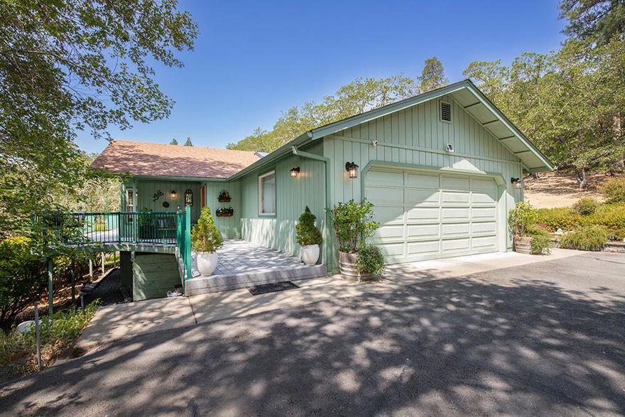 Would you like a Beautifully Updated Home, Breathtaking Views, and 2 Detached 2 Car Finished Garages, including one with a Shop on 5.94 tranquil Acres? Enjoy the Privacy, and Peace of country living away from town, but close to conveniences. With 1,786 sq ft of sunny, vibrant living space, you'll love the vaulted ceilings, skylights, and gas, stacked-stone fireplace. The spacious kitchen is perfect for entertaining, featuring a large island, breakfast nook, and a pantry. Relax in your charming primary suite which includes dual closets, en-suite bath, and access to the expansive deck to soak in the sunshine and views. Outside, you'll also find a paved driveway, two-car attached garage, Plus, an adorable potting shed that adds to the charm. This property is the perfect blend of comfort, style, and country tranquility—just minutes from town, Applegate Valley wineries, shopping, and medical. You really should see this property in person.