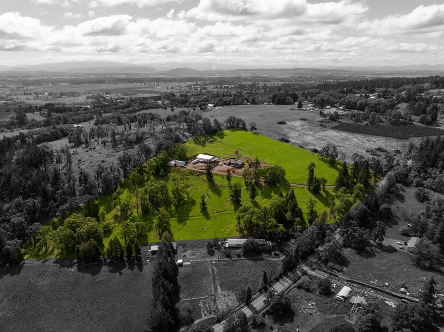 Welcome to your stunning 17-acre ranch estate! This impressive property features a spacious two-level, 4,000 square foot home that includes 6 bedrooms, 4.5 bathrooms, and a finished daylight basement. Additionally, there is an accessory dwelling unit (ADU) ready mother-in-law suite with its own kitchen and living quarters. Outside, you will find 7 fenced pastures, a garden area, and a 3,456 sqft 3-bay shop equipped with a bathroom and 200 AMP service. The estate also includes a large 2,720 sqft barn. With plenty of room for horses or other livestock, this ranch offers endless possibilities and is truly a rare find! Schedule a viewing today!