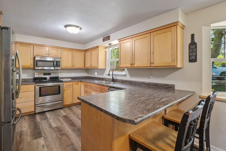 Enjoy the peace of country living with the convenience of being close to town—and an incredible shop to top it off! This single-level ranch offers 2,044 sq ft with 3 bedrooms, 2 bathrooms, an office, and a bonus room, all on 1.65 private, fully fenced acres. Tucked behind a gated wraparound driveway, this property offers privacy and space to stretch out. The oversized detached 2-car garage is complemented by a brand-new 40x41 shop featuring 13-ft roll-up doors and 15-ft interior height—perfect for RVs, boats, or serious workshop needs. Room to live, work, and unwind in your own quiet corner of the world.