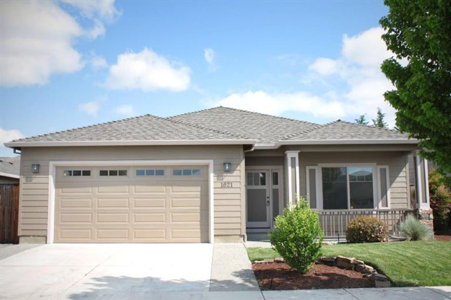 Beautifully built PacTrend home in the peaceful East Medford Papillon Estates neighborhood. Brand new interior and exterior paint and an open floor plan with approximately 1564 square feet including 3 bedrooms and 2 bathrooms plus a formal dining room that could be used as an office or converted into a fourth bedroom. Hardwood floors in entry and the very spacious kitchen which boasts granite, tile backsplash and stainless steel appliances plus an eat in bar. Dedicated laundry room and a walk in closet in the master bedroom! This house is immaculate and has a brand new hot water heater. Very desirable Abraham Lincoln, Hedrick and North Medford school district location.