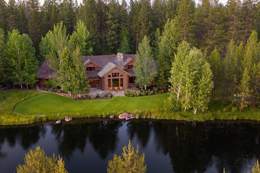 Inspirational Lakefront Setting. You will find a true haven of peace & tranquility in this authentic log home estate, artfully designed by noted Architect Janet Jarvis. Located in historic Vandevert Ranch on the edge of Rainbow Lake with only the finest quality finishes: integrated plaster walls, Alder floors & cabinets, rustic pine vaulted ceilings, Montana stone fireplace, Rajah slate, hand forged hardware, solid Alder doors, & Kentucky Blue stone walkways/patios. Big picture windows, Great hall entry & dining room w/a magnificent 3 tiered iron chandelier & exposed beams, chef's kitchen, large main level master suite w/library/den & fireplace. Plus new 20 KV back-up generator, furnace & hot water system. This private gated enclave of only 20 homesites w/about 350 acres of shared common & open space offers endless trails along the Little Deschutes River, surrounded by meadows & Cascade mtn views. Ranch amenities include equestrian facilities, community barn & dog kennels. Golf Nearby.