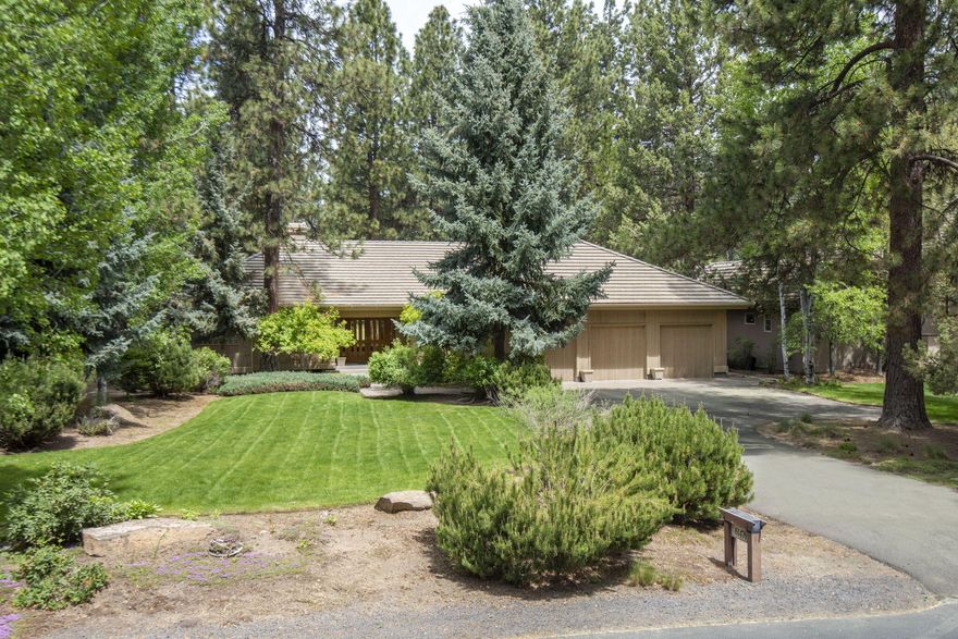 Backing onto the 3rd fairway of the prestigious Broken Top Golf Course, this beautiful single-level home is on the market for the first time. Enter through a charming foyer into a spacious, light-filled living room with vaulted ceilings, gas fireplace, built-in cabinets, and a wall of picture windows showcasing the lush green fairway. The open kitchen boasts granite tile countertops, a wet bar, wine fridge, large island, and pantry. Adjacent is a cozy dining area framed by picture windows. The primary suite, conveniently separated from the secondary bedrooms, opens via French doors to a paver stone patio and features a luxurious bathroom with a jetted tub, tile shower, dual vanities, water closet, and walk-in closet. Each secondary bedroom has its own ensuite bathroom, ensuring comfort and privacy. The laundry room includes a built-in desk and cabinets, with access to the 3-car garage. Don't miss your chance to own this stunning home! Contact your favorite agent for a personal tour.