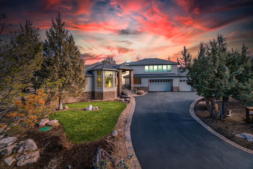 Enjoy sweeping views of the Cascade Mountains from this gorgeous custom home in Eagle Crest Resort! Open-concept floor plan featuring a great room with soaring ceilings, walls of windows, gas fireplace, and Madrone cabinetry and built-ins throughout. Chef's kitchen with slab granite countertops, five-burner gas cooktop, walk-in pantry, and stainless appliances. Master suite with walk-in closet, tray ceilings, tiled walk-in shower with multiple shower heads, jetted soaking tub, and double vanity. Two guest suites; one en suite, formal dining room/main level office, a half bath for guests, and a spacious utility room with a brand new work center and cabinetry. The upper level features a bonus room with a built-in wet bar, gas fireplace, and wall of windows with panoramic views, and a  large office/workspace with a built-in work center. Expansive paver deck overlooking the common area and creek. Oversized four-car garage with half bath and large storage area under the home.