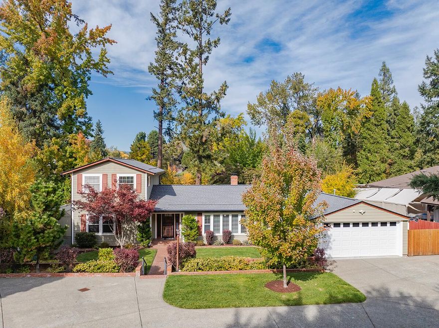 Beautiful Riverfront Home with Private Dock.This lovingly maintained & updated 3 bed, 3 bath, 2,464 sq ft home is set on a stunning .66-acre manicured lot.  
Enjoy sweeping river views from the large windows in the light and sunny great room with fireplace, and hardwood floors. The updated primary suite features a private deck overlooking the property & river. The floor plan includes an updated kitchen with new appliances, formal dining room, and breakfast nook, all designed to maximize your views. Relax on the spacious patio or at the deck by the river's edge surrounded by beautiful landscaping, tall trees, and flowering shrubs. Recent updates include a new roof, HVAC system, and Generac 22kw whole-house generator. Outside you'll also find a Gated entry, a 2-car garage, and RV parking. 
Take advantage of this rare opportunity to own a riverfront gem combining timeless charm, thoughtful updates, and peaceful Rogue River views.