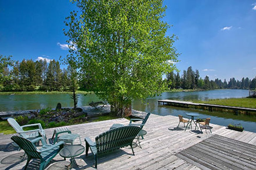 Incredible redevelopment opportunity for this private riverfront site on Oregon's iconic Big Deschutes River. The parcel lies just across Spring River Rd. from the popular Sunriver Resort, directly across the river from the 14th green of the world-famous Crosswater Golf Course, & abuts a private 2.7 acre common area. Historic non-conforming uses are documented with the County & make this one of the most unique pieces of property in Central Oregon. Features include three separate residences (1,727 sq. ft. single-family residence, 672 sq. ft. manufactured home, & 420 sq. ft. ADU apartment), almost 2000 sq. ft. of warehouse, 3 RV stalls, corral/horse stall, almost 100 ft of prime river frontage, 180 ft of permanent dock, & the largest and deepest privately owned boat inlet on the river. A large portion of the residential structures front the river & are not subject to the 100 ft setback that has been imposed on developments for decades. Please do not enter driveway without an appointment.
