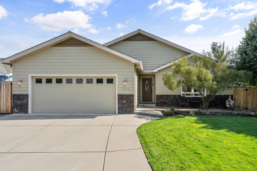 This beautifully maintained 3-bedroom, 2-bath home offers 1,771 sq. ft. of thoughtfully designed living space in the desirable Candlewood subdivision. The inviting open floor plan features vaulted ceilings, a cozy gas fireplace, and plenty of natural light—perfect for both everyday living and entertaining. The primary suite is a true retreat with a walk-in closet, dual vanity sinks, and private access to the covered back patio. Outside, enjoy the low-maintenance yard and covered patio, ideal for outdoor dining or quiet mornings.