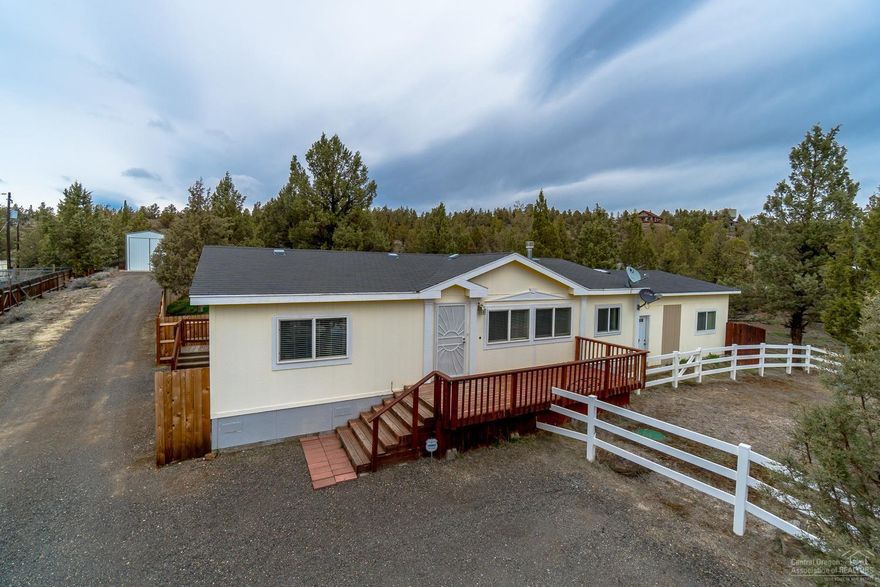 Urban farmhouse appeal in a quiet, rural setting. Completely updated w/gas fireplace w/modern stone surround, slab Granite counters, classic subway tile back splashes & hand scraped wood look flooring in living spaces. Barn door accents, designer paint colors in an open concept floor plan. Kitchen features an over sized island, apron front farm sink & Stainless Steel gas range w/custom range hood. Spacious Master Suite w/barn door closet, tile shower & granite counters. Additional bonus rooms accessible from the back yard & are included in house square footage (400 sf). Carport for extra covered storage and an RV garage w/ 220!