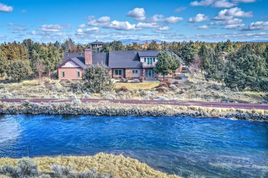 Stunning custom home w/2+ acres on seasonal CANAL. Enjoy SINGLE LEVEL living with upstairs bonus/living area and full bath. Luxury finishes include wood clad windows, wood/tile floors, solid wood doors, built-ins, surround sound. Kitchen with alder cabinets, wall oven, 5 burner stove-top, dining area & walk-in pantry. Formal dining room and living room w/stack stone gas fireplace and built-ins. Master bedroom, bath with walk-in shower, soaking tub & radiant floor heat. 3 bedrooms have attached baths. Bedroom/office with built-in desk/cabinet and lock-off security closet. Main floor bonus room/office. Upstairs guest suite/bonus room w/wet bar is reinforced for pool table, w/full bath and balcony. 2 upstairs storage/craft rooms. 2 heating/AC systems & 2 water heaters. Backyard with view of canal, concrete stone patio & pergola. Area for RV garage and attached 4 car garage with 2 wider doors, cabinets & heater. Exterior paint in 2018. Close to schools and hospital.