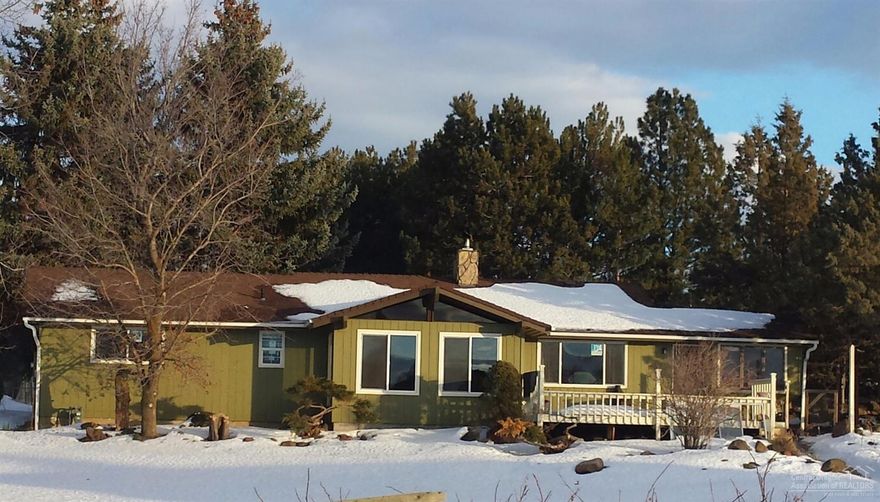 Close-to-town horse property with a view of Pilot Butte & the Cascade Mountains! SINGLE LEVEL 2500 sq ft 3/2 with a 1000 sq ft SHOP, partially fenced 2 Ac parcel and 1.34 Ac irrigation. Fresh paint & new laminate flooring. Bonus room, sun room, family room & living room makes for lots of room for you!