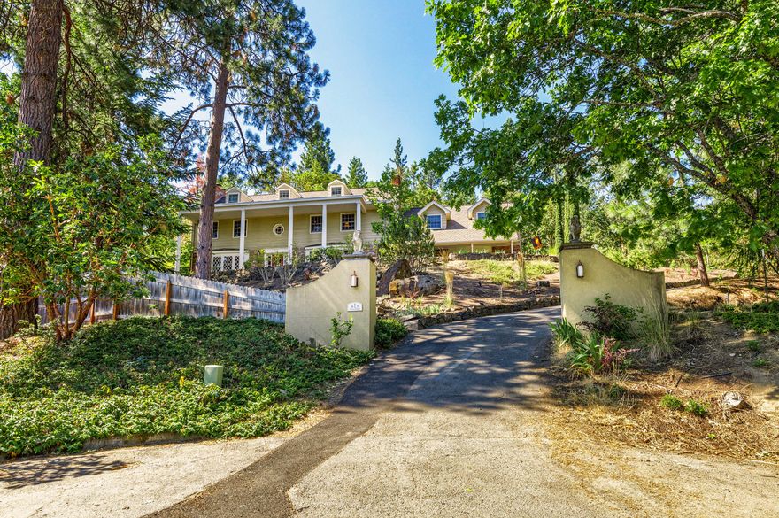 Premier Ashland Property, nestled in the hills of Southern Oregon, minutes from Southern Oregon University, 5340 Sq Ft, executive home on .99 acres with stunning views of Grizzly Peak,1 mile from downtown. Gated drive with two entrances. The home  boasts 3 stories & 4 fireplaces, plumbed for gas. Main floors feature Brazilian Cherry Flooring, spacious dining and living rooms, a luxurious master suite with attached office, limestone floors w/radiant heat, glass tile steam shower and soaking tub, 4 additional bedrooms, 3.5 baths. Potential for 2 family set-up. Library, commercial grade bar, chef's kitchen with 6 burner stove, double ovens, subzero frig and wired for sound throughout the home. Enjoy the inground pool/ hot tub, meticulous landscaping and renovated outdoor spaces. 30 foot waterfall, 1/2 basketball court, a 3 car garage and access to miles of hiking /biking trails from the property. Plenty of extra parking for RV, boat and toys.