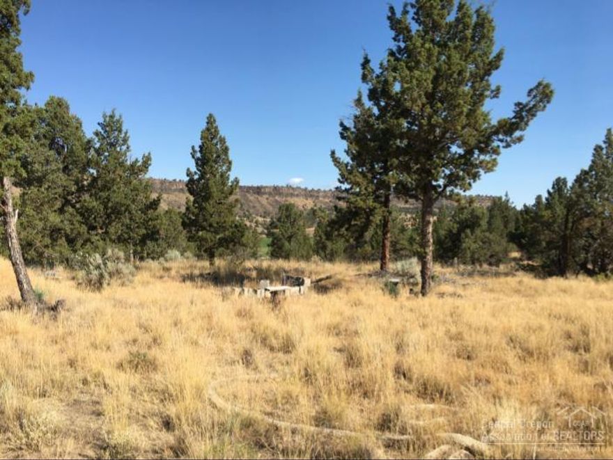 Country living, close to town with beautiful Crooked River Valley views. Build your dream home here. This property has 2.5 acres of prime real estate and is in an area of good wells. The septic was approved but needs re-evaluated. There is a small storage building near a fantastic building site. The property is located contiguous to 3426 S Crooked River Hwy on the North side. Call, email or text for additional information.