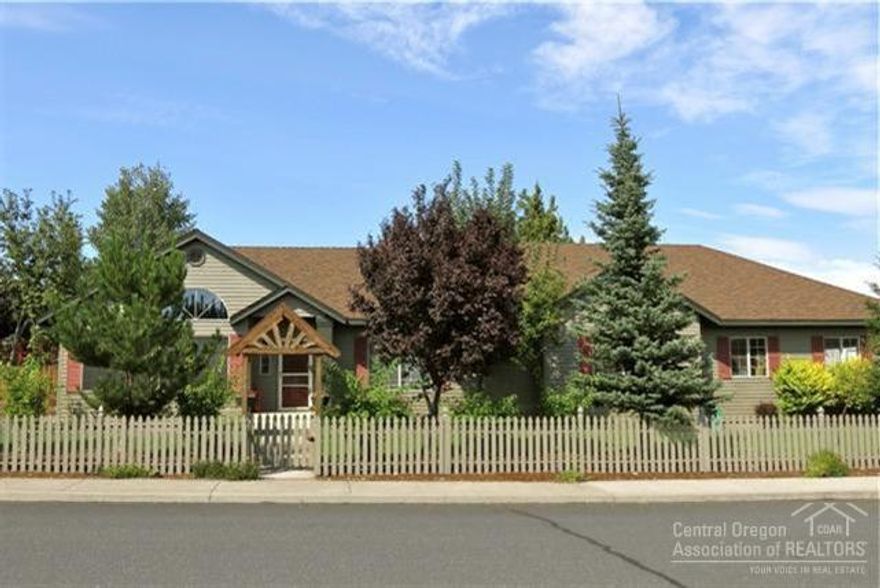 MUST SEE this immaculate single-level! Bright open floor plan features vaulted ceilings & skylights. Wood floors throughout, tile countertops, stainless appliances & master suite with soaking tub. Large great room with corner windows. Mtn & Pilot Butte views from beautiful front yard, private paver patio, deck & water feature. 3 car garage!fenced area for RV too