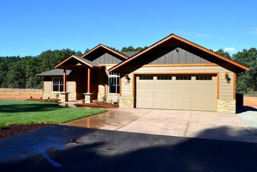 Amazing value! Brand new Custom home with many upgrades on a gorgeous, all level and usable lot just mins away from the Rogue River. Only 10 minutes to town and loaded with quality! Sitting on a beautiful piece of meadow sits this new home with many sought after features. The exterior is cedar and stone accented with hardwood floors and granite and best of all including the latest energy efficient features. 2018 built home is such quality and would easly qualify for a green home from a few years back. The property is all usable and all fenced! Included is an automatic gate and RV parking. Inside is a large great room plus a den with hand scraped hardwood floors in the living, dining, den and kitchen, and covered porches plus a wonderful split floor plan makes this home very comfortable as well as easy on the eyes. This is a great value at a low price and this combo does not come along often. All information deemed accurate but not guaranteed; buyer to perform their own due diligence