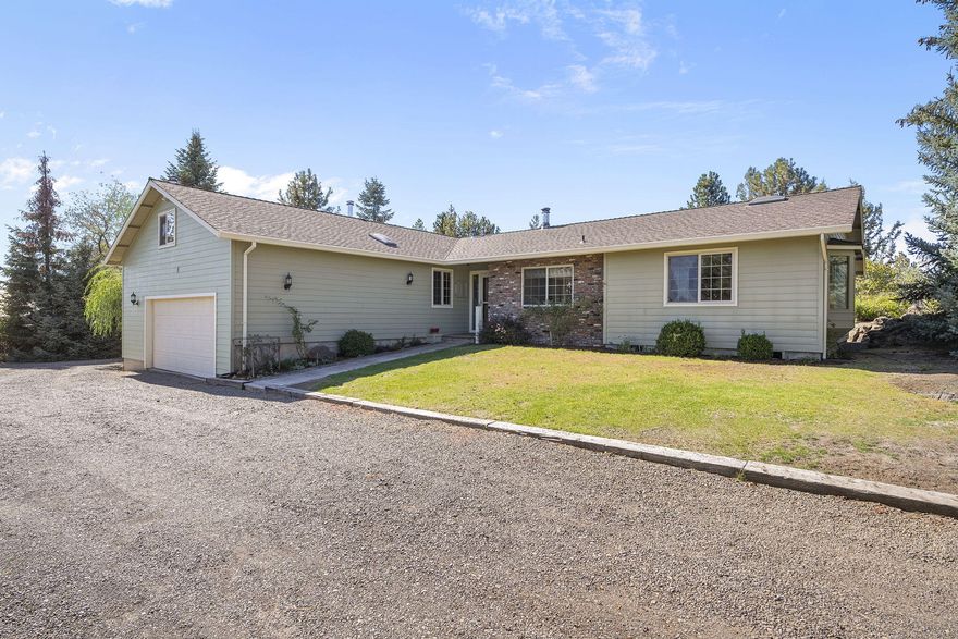 First time on the market! This original-owner, single-level home sits on 1.63 acres with certified water rights (.60 acres) and Cascade Mountain views. The elevated setting overlooks the pasture, offering an ideal opportunity for a horse set-up or hobby farm. The home features a main-level primary suite, two additional bedrooms with a full bath, a spacious living room, loft office/craft room, and an attached two-car garage. Mostly in original condition, this property is ready for your vision and updates. A rare chance to own small acreage with big potential in Central Oregon!
