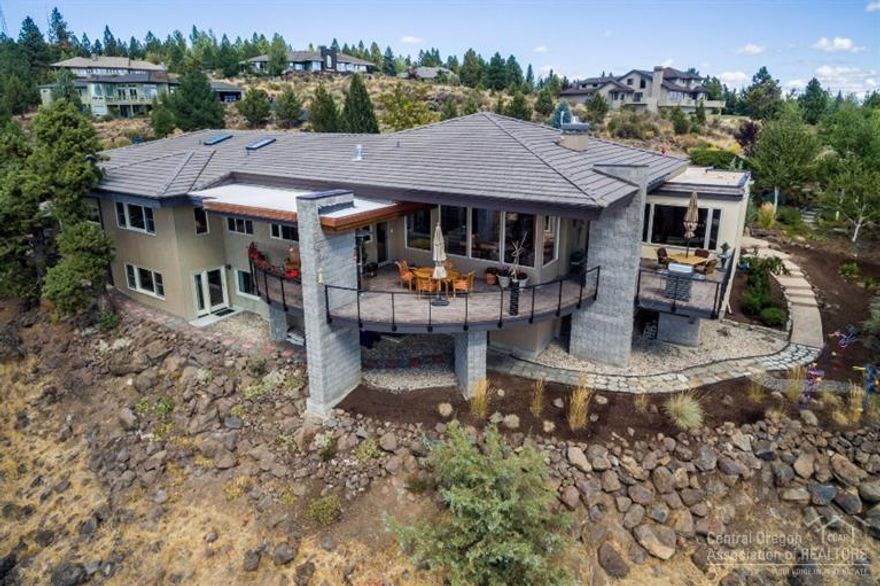 Contemporary West Side home with fabulous mountain & city views. Nestled against the hillside with easy access to the market, downtown, Drake Park & restaurants, this home enjoys a very private setting. A beautiful garden entry leads into the 3,842 square feet with open floor plan, picture windows to frame views from every angle, and large patio spaces for extended outdoor living. All bedrooms & office on main floor; smart multi-use rooms add flexibility including office, bonus & fitness rooms.