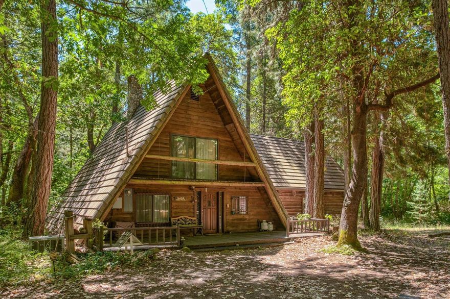 Over the River and Through the Woods...to this gorgeous A-Frame, Log home on 6.25 acres with it's own creek and pond! Just a few miles out of town, this lovely home features 2277 sq ft, 3 bedrooms, 3 full baths, a beautiful stone fireplace, vaulted ceilings, open floor plan and master suite (added in 1991) with loft/office, bay window seat, walk in closet & large bath. The wall of windows brings the outdoors in and the back deck overlooks the creek, pond & visiting wildlife! Exterior features include, garage/shop, large carport with storage building, gazebo, steel reinforced bridge (in 1997) & gated entry. Opportunity awaits to own this unique, charming slice of heaven in Oregon. Is this YOUR new home?