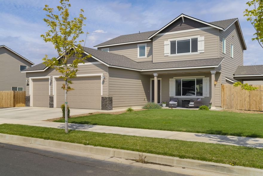 Welcome to your dream home! Nestled in a charming neighborhood, this sprawling 2386 sq ft residence blends luxury and comfort with its 4 spacious bedrooms and 2.5 elegant baths. The primary suite on the main floor is a retreat, featuring a sumptuous soaking tub and an expansive walk-in closet. Upstairs, discover three generously sized bedrooms and an extra-large loft, perfect for a TV room, game room, or office. The state-of-the-art kitchen will impress any chef with its stainless 5-burner gas range with air fryer and convection oven, quartz countertops, large island, and pantry. All energy star appliances, including a refrigerator and dishwasher, make this kitchen both stylish and efficient. Enjoy comfort year-round with a forced air gas high-efficiency furnace and a cozy gas fireplace, plus the convenience of a spacious 3-car garage. Step outside to a landscaped yard, complete with a fully fenced backyard and a lovely covered patio perfect for outdoor entertaining.