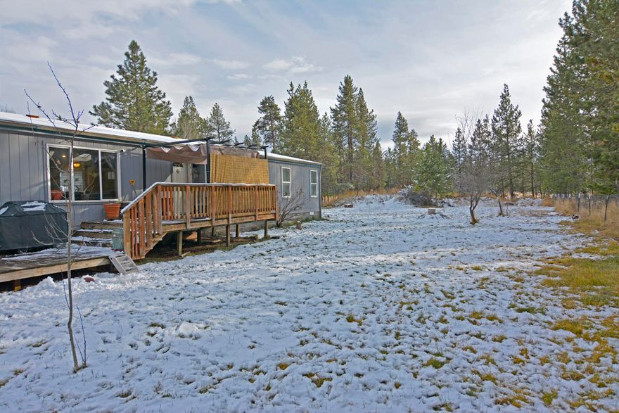 This home sits on .48 acres, off a paved road with community water and sewer. Community features a dock and boat launch on the Big Deschutes River, close to Sunriver, Cascade Lakes and Mt. Bachelor. Room to park your toys, gravel wrap around driveway. This home features new laminate wood floors, vaulted ceilings, built in desk area in the kitchen, new refrigerator & kitchen faucet, master bedroom with new flooring, master bath with soaking tub, double sinks and large laundry room. Ductless heat pump.