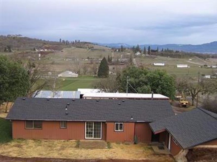 Wonderful country setting with a clean ranch style 3 bedroom and 2 bath home with a newly remodeled kitchen, new carpet and paint inside. This home features over 1500 sq. ft and is located on almost 3 acres. Sitting at the back of the property on a knoll you overlook, barns, pastures while keeping the views of the Table Rocks. Huge front deck, mountain and valley views. There is maple hardwood flooring installed. Two great barns featuring a 6-stall pole barn, regular style barn with 6 stalls and fenced pasture! This is a great property for those with horses or want a 4-H style set-up. Privacy and seclusion, yet close to town. Pleanty of room to park RV's, toys or heavy equipment.