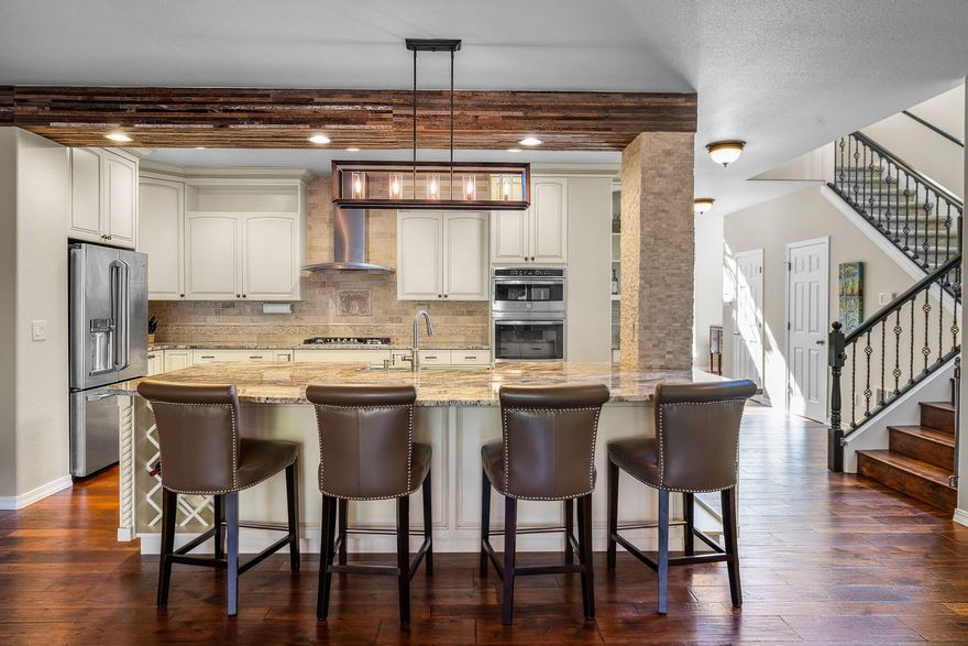 River trail access just a short 5 minute walk from this gorgeous, updated townhome in River Canyon Estates! Beautifully updated, quiet, end-unit townhome invites you to enjoy a lifestyle surrounded by nature. Neighborhood amenities include a pool, clubhouse, fitness center, and tennis courts, all directly out your front door! Inside you will find rich hickory wood floors, a gourmet kitchen, and custom built-ins throughout. The private, fenced courtyard with a peaceful fountain creates a perfect retreat, often visited by quail and hummingbirds. The home's flexible layout includes a spacious ground-floor office/4th bedroom and full bath—plus an expansive and luxurious primary suite and two more bedrooms upstairs. Blending comfort, elegance, and easy living, this exceptional, move-in ready home is a true sanctuary in a vibrant community. Very lightly lived in, second home. Maintenance free living, HOA covers landscaping, roof, paint, siding, fence and insurance.