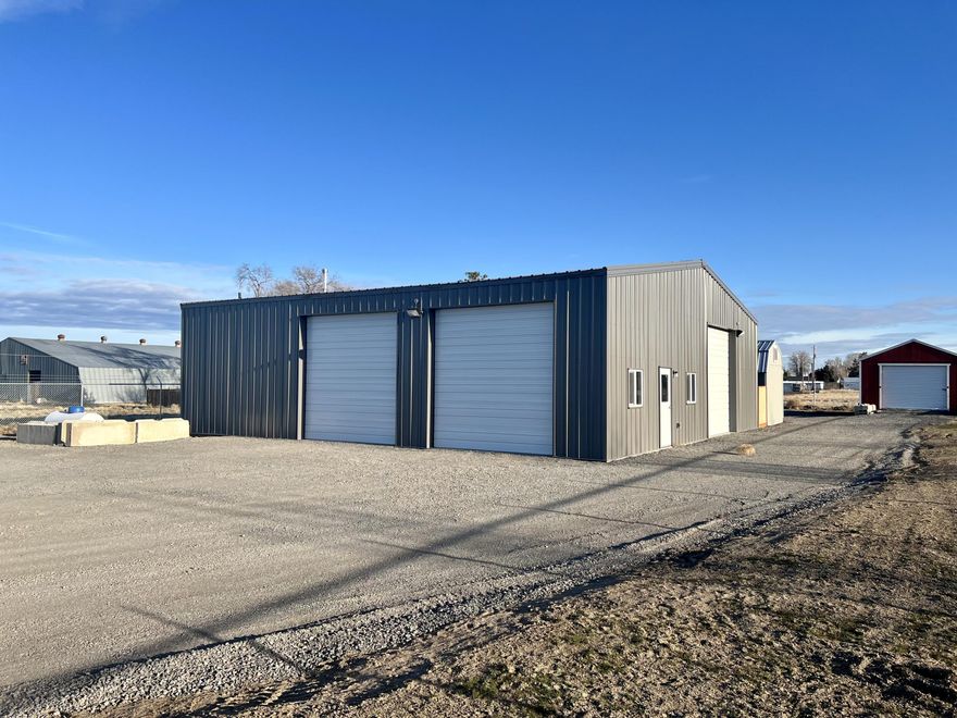 Brand new 50x50 commercial shop with full ADA bathroom (tub/shower combo) with washer and dryer hookups. Insulated with 400 amp service. 16 foot interior ceiling. 3 overhead roll up doors, 12ft tall doors (1 door has garage door opener). 200,000 BTU propane heater, 2 windows, 1 man door. Cement and sealed floors. Full security fenced yard totaling .45 of an acre (19,602 sq.ft.) Located centrally in City of Metolius.