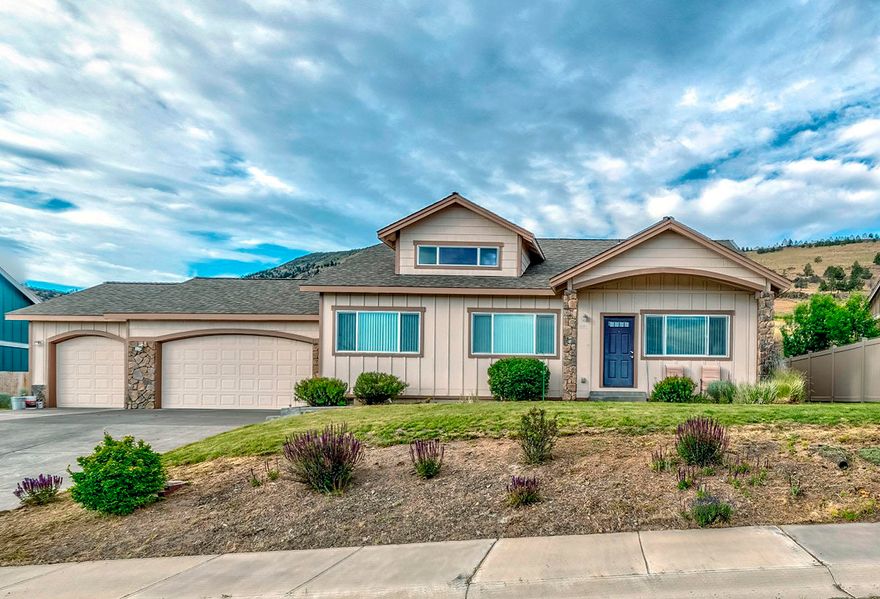 This home shows like a brand new house! Vaulted ceilings and open living room. family room and dining areas make this home feel huge!  The kitchen has hickory cabinets, tile floors and Tuscany tiled counters, a corner pantry, and a large counter bar open to the dining area.  Family room area has a gas corner fireplace. Good sized  bedroom with walk-in closet and on-suite bath with double sinks and hickory cabinets.  The attached 3 car garage has a finished, painted interior. Central air-conditioning was added last year. The landscaped front yard has in-ground sprinklers and currently this home has a breath taking VIEW of Mt Shasta and the City lights!  The back yard has a stone patio area and plenty of yard space behind the garage area for you to finish to your liking!