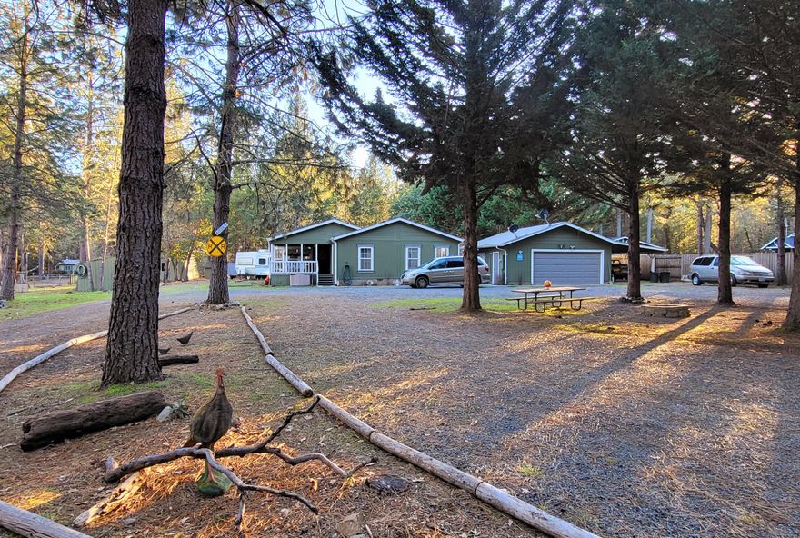 Ready set, country life!  Enjoy this spacious 3 bedrooms, 2 bath,den, decks, garages, carports and more on 2.46 ￼ acres. This home is close to the Rogue River Wild and Scenic area with a short walk to the Rogue River and sandy beaches! This level property includes Improvements like 2 decks, custom exterior, and interior paint, newer kitchen countertops, sink, fixtures, dishwasher, range, new bathroom countertops, fixtures, fans and tile work around the spa bathtub. Simple landscaping with tall evergreens to enjoy all Oregon has to offer.  Many extras on this Oregon Gem.  Tenants occupy property so please make appointment to see. Gated entry.  All information deemed accurate but not guaranteed and subject to change at anytime.