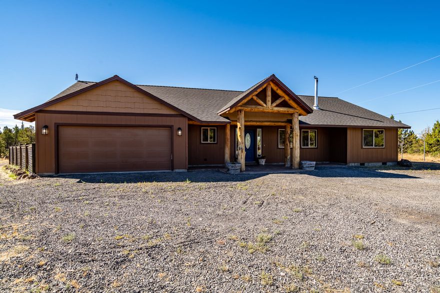 Welcome home to your slice of serene Crooked River Ranch in Terrebonne, OR. This beautiful single level home features open living with a wood burning stove & A/C to keep you comfortable all year long. Kitchen features hickory cabinets, tile flooring, SS appliances, bar seating, & granite countertops. The open floor plan offers vaulted ceilings, river rock hearth, & inlaid barnwood accents. Primary suite has ample storage with 2 walk-in closets, double vanity, & tiled shower. Spacious laundry room with sink leads you to a partially converted garage offering additional room. Outside enjoy the 1.70 acre lot with play structure, multiple outbuildings, fenced dog run, & chicken coop. Log cabin has power & A/C. Lot also features RV parking & power. Come enjoy the peace & quiet with all of the CRR amenities! Including pool, tennis/pickleball courts, 18-hole golf course, RV Park, several parks, baseball field, basketball court, horse arena, & more. Turn key & ready for your personal touch!
