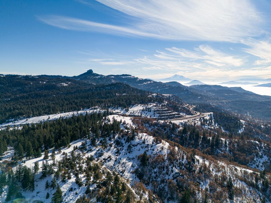 Private rural acreage with strong well, septic system, and former homesite with stunning panoramic views of the Colestin Valley and Mt Shasta. Property is comprised of approximately eight acres that are easily accessible and relatively flat, 22 acres of sloped area, with a rough trail that has been used to access a lower pasture area. Located just 13 miles from Ashland's downtown plaza, eight miles from the Mt. Ashland Ski Area, and less than one mile from the Pacific Crest Trail. Inquire with agents to access well and septic documentation, surveys, maps CC&Rs, title information, Vacant Land Disclosure Addendum, and additional media!