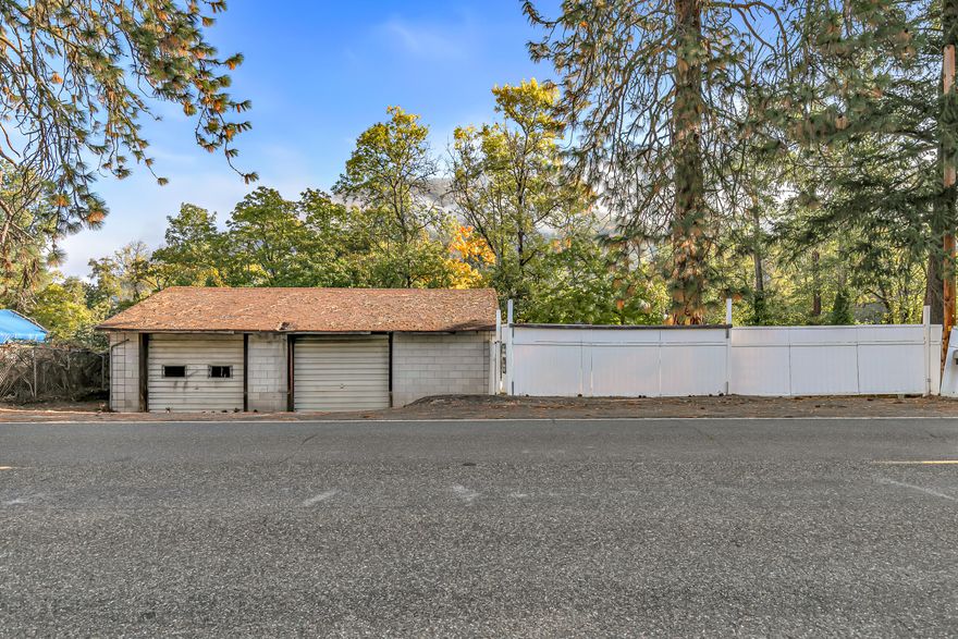 Location, location, location! Searching for a beautiful waterfront parcel right off the Rogue River? If so, this is the one for you! This riverfront property features a two-car garage, cement pad, underground holding tank, power, well, pressure tank, & gated entryway. Minutes away from Downtown Rogue River, this is the perfect opportunity for anyone looking to recreationally park their RV while working on their favorite project in the garage! This one won't last long on the market, so contact your agent today for a personal tour, before its too late!