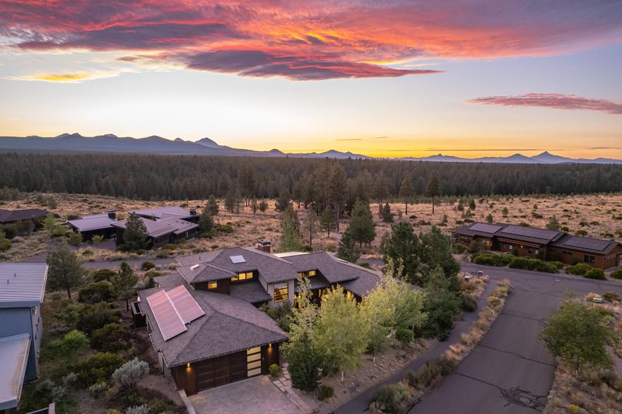 Nestled in highly sough after Shevlin Commons, this home offers ultimate privacy and breathtaking mountain views. Designed to blend with the natural landscape, it features a private front courtyard, tranquil water feature, and secluded patio. The great room, bathed in light from a wall of windows, showcases modern design. The kitchen is a chef's dream with custom cabinetry, GE Monogram appliances, a beverage fridge, and access to a covered patio. Main-level living includes a primary suite and a second suite/office with a private entrance. Upstairs, find two more bedrooms and a cozy loft for reading or play. This exceptional home includes a three-car tandem garage, spacious mudroom, hidden sauna, fire pit, and extensive outdoor living. Enjoy stunning views and unparalleled peace, privacy, and quality. Entered for comps.