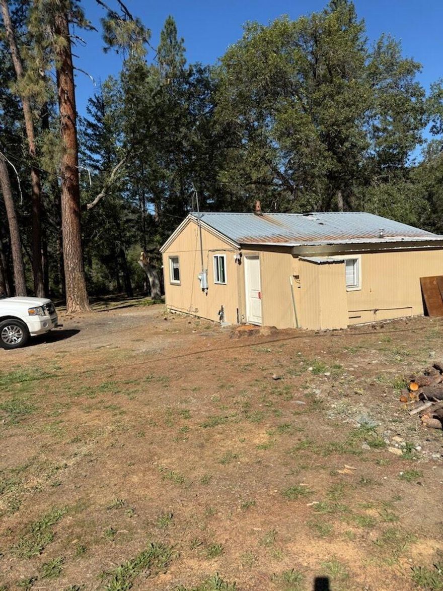 Incredible opportunity to own over 6 acres in the Applegate Valley. 4 miles from Applegate Lake! Current home is a 2 bedrooms, 1 bathroom cottage with lots of potential. Buyer to do due diligence on condition of home and roof as a tree falling caused some damage to roof, attic and ceilings. Seller is willing to carry financing.