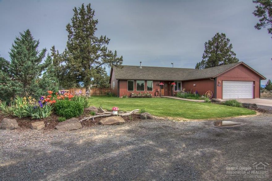 Powell Butte Paradise Ready For Horses. Great 4 bed 2 bath 1920 sq ft home with hardwood floors country kitchen w/breakfast bar some ceiling vaults and more on 7.93 acres. Park like landscape w/sprinkler system,fenced yard,impressive fenced garden w/raised beds & sprinklers.30 X 36 shop w/10ft doors,work bench& power,24 X 30 insulated shop building w/power utilized as barn, tack room. Nice horse paddocks and horse shelter. Even 2 RV hook ups on this impressive property with privacy some mountain views