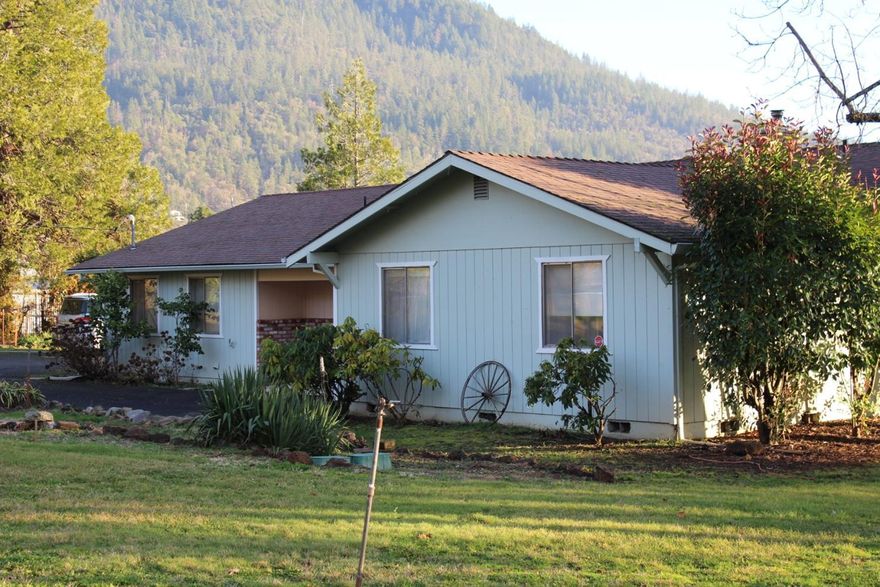 Here it is..This is one of those long awaited for FIXER's you've dreamed of finding like on those wonderful real estate shows!! Here are the highlights 1)LOCATION, LOCATION, LOCATION~Coveted lovely Colonial Valley. You will want to notice the homes around this little gem, they are much more expensive..$investment$! And, some are estate type homes!! 2) This is a sought after single level home with a super floor plan..3bd/2 bath, w/ office nook situated neatly on 1.5 acres of flat usable gorgeous land. 3) Views of the surrounding mountains on a nice quiet road. You will be amazed at the sunsets from this property to be enjoyed from the covered patio! Oh, fruit trees!! A fabulous array of established fruit trees!! This property needs some clean up, some freshening up, and updating (flooring especially). For the right buyer...someone who brings their tools/trailer, a few bucks and a vision for what could be, this little 'As-Is' diamond could possibly turn into an 'acre of diamonds'!