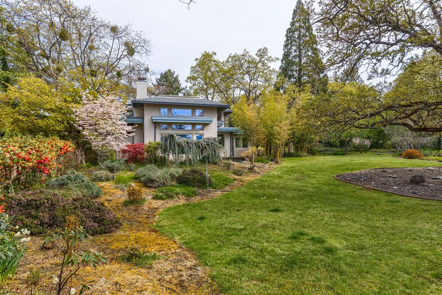 This is a one of a kind property in Old East Medford.  Situated on .97 of an acre, with a small vineyard at the front of the property, the home is a gem in a neighborhood of large estate style properties.  The home is 2512 square feet with a vaulted ceiling living room opening into an updated kitchen with granite tile counters.  There are two bedrooms and one full bath downstairs, and two bedrooms one bath upstairs.  There are perennials and beautiful oaks on the property providing privacy and seclusion.  A must tour home in a wonderful neighborhood.