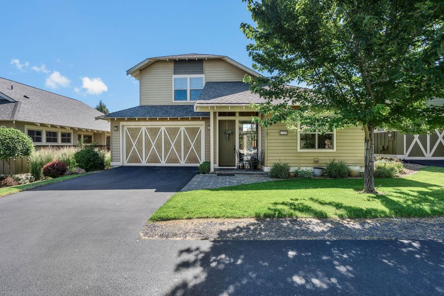 Enjoy all the fine amenities of Eagle Crest Resort each day from your private oasis on the west side of the Butte near Lakeside Sports Center. Situated on the edge of vast BLM land, you'll enjoy amazing views of the Cascades from upstairs. Vaulted great room w/new durable wood look flooring in main living areas, stacked stone cozy gas burning fireplace w/natural Slate accents + mantle, built in media cabinet. Floor to ceiling windows/sliding door opens to the back patio inviting an abundance of natural light. Kitchen features granite countertops, ample cabinetry & counter prep space & breakfast bar seating. Primary on the main features sliding glass door to the private patio, lg walk-in closet w/built-ins, dual vanities in bath w/tile shower & enclosed water closet. Two well-appointed bedrooms, loft space, & spacious full bath upstairs. Living in Eagle Crest includes access to 3 recreation centers, golf, tennis, pickleball, spa, miles of trails & much more.