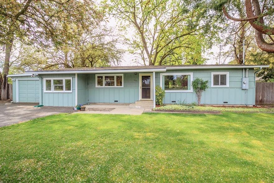 Great rural location, close to town. 3 bedroom, 1.5 bath home with an additional room that could be 4th bedroom, office or hobby room which is on a .38 acre lot. There is a dining area and family room off of kitchen w/stainless steel appliances that opens to back yard. Property is the perfect size & place for family fun with a private garden area, above ground pool, 16 x 12 shed and room for plenty of toys too. Fenced yard, mature trees and territorial views provides a nice place to entertain with kids, family and pets. The above ground pool is 14 x 21 with a sand filter. Newer HVAC system and a new roof in 2014. Property has it's own well w/holding tank, Rogue Valley Sewer and natural gas for services. Approx 40 ft RV parking has electrical hookup with additional parking behind fence for boat, utility trailer and more. One car garage has workbench and additional room for storage. Griffin Creek School District.