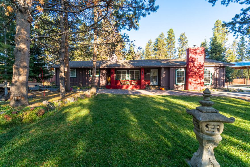 Quiet country living on your own fully fenced 0.98 acre private oasis w/plenty of room for all your critters & toys! Great room boasts beautiful brick surround wood burning fireplace, natural light from large windows, & built in bar area w/sink, built-ins & storage! Kitchen ftrs electric double ovens, Bosche gas propane cooktop, tons of cabinetry & counter space for prep, tiled floors & easy access to separate dining room! Addtnl family room/den w/wood burning stove & brick wall is right off the kitchen. Large primary bedroom & bath plus additional bedroom w/full bath are conveniently located. 2 year old roof, 50 gallon owned propane tank, covered RV parking on site, 2car garage w/shop, raised garden beds w/paver surround, covered front/back deck/patio & your own outdoor pizza oven! Come live & play in the mountains, lakes, rivers, desert & all that Central Oregon has to offer while watching wildlife right out your own front door! Deschutes National Forrest is minutes away!