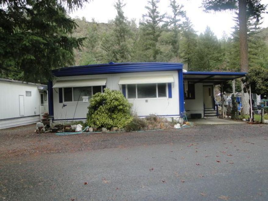 Very clean doublewide mobile home in 55+ park. Mature landscaping. Newer features include kitchen cabinets with roll-out drawers, heat pump, stove/oven, and double paned windows. Attached, enclosed porch area with storage/pantry.