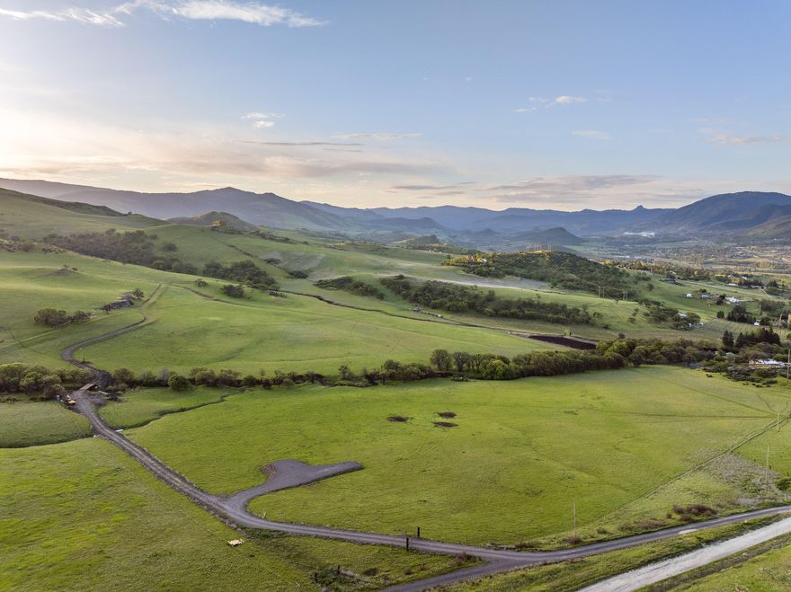 Nestled in the serene eastern foothills of Ashland, Oregon, this exceptional 31.72-acre homesite lot offers an opportunity to create your dream estate. Situated at an elevation of just over 2,200 feet, this picturesque parcel boasts breathtaking panoramic views of the surrounding natural beauty.  With homesite and septic approval already completed, it's ready for you to start building! The gentle sounds of the creek create a soothing backdrop, perfect for relaxation and rejuvenation. Zoned EFU (Exclusive Farm Use), this property offers a range of possibilities for agricultural pursuits, while also providing a peaceful and private setting for a custom-built home. Homesite approval has already been completed, streamlining the process for creating your ideal living space.