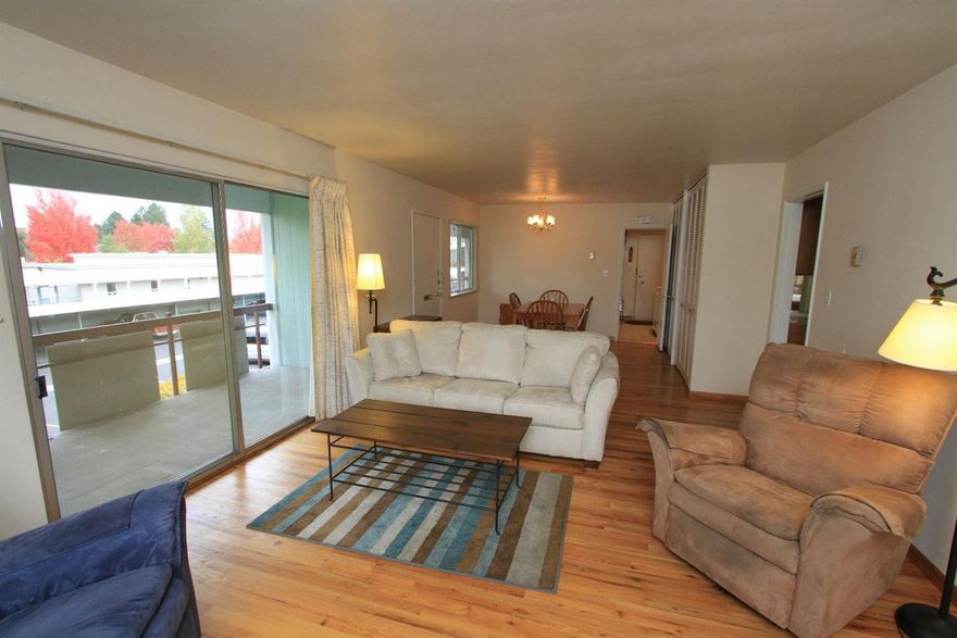 A great place to live at a fantastic price! Spacious 1 bdrm, 1 ba partially furnished apartment in 55+ co-op community. Close to shopping, hospital & medical facilities, movie theater and bus-line. Light & bright second floor corner apartment w/view of the mountains & large private balcony. Large living room w/dining area. Kitchen has fridge, dishwasher, stove & small freezer. Great amount of storage in this unit. Hardwood floors. There is a manicured lawn leading out to the heated pool w/pool house pavilion & BBQ. Included in monthly dues: on-site laundry, water, sewer, taxes, building insurance & grounds maintenance. This is a second floor unit w/elevator & stair access to 2nd level. An ideal home for someone wanting a beautiful place to live. Fantastic location & at a great price. Covered parking & private storage.