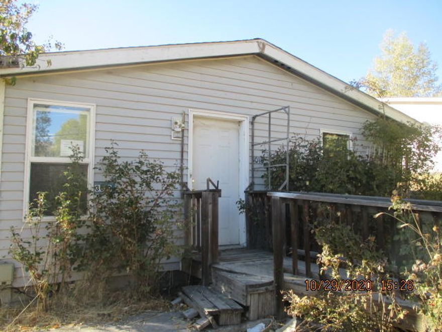 Great location just three miles West of town, the home is located near the end of Butte Street and has very little traffic. The mfg. home needs TLC & updating and is priced accordingly.  Large 1/3 acre parcel with room for shop, garden area and RV parking.  Mfg. Home is a 1997 Karsten.  Please call for more details!  This property may also be marketed via an auction event at https://www.hubzu.com (void where prohibited). This property may also be marketed via an auction event at https://www.hubzu.com (void where prohibited). The Seller will review offers submitted through the auction site as well as through the listing agent.   All offers submitted to Hubzu.com, while the property is in the auction inventory, will be
subject to a 5% buyer's premium or a minimum buyer's premium of $1000, whichever is greater.