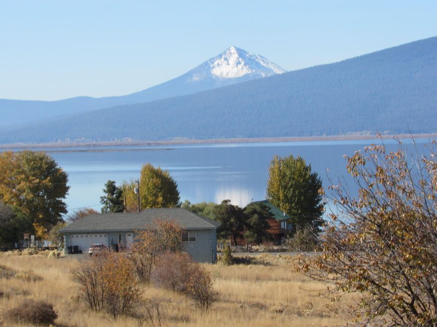 Oversized lot in Oregon Shores II-.33 of an acre-big enough for utilities & amenities.  VIEW VIEW VIEW & Manufactured home allowed-very hard to find a lot with views of Agency Lake & Mountains that also allows a manuf. home.  Oregon Shores II has its own rural water district (wells) so no need to drill your own well-saving you thousands! Just need a septic & power hook up and your dream home!  Members of OS II have full use of their 17 acre gated park right on the lake-sandy beach, lake access plus restrooms, kitchen facilities and even an RV park for your guests to use at a reasonable rate.  Close to many outdoor unique places such as Crater Lake Natl Park, headwaters of the Wood River, trophy fishing on the Wood & Williamson Rivers + kayaking on Spring Creek. Short easy trip to Klamath Falls-30 miles or so, for shopping, medical, business etc. This area is a banana belt -snow is gone on this side of 97 much sooner. OSII roads plowed & graded. Beautiful sunsets!!