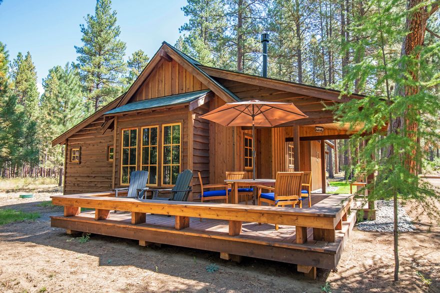 This Cabin provides an opportunity to acquire a 1/4 shared interest in an almost new cabin at historic Lake Creek Lodge in Camp Sherman. This cabin radiates excellence, featuring exquisite finishing touches & stylish furnishings. Constructed in 2022, it possesses a nostalgic charm reminiscent of yesteryear. The cabin includes three  bedrooms, 3 baths (2 en-suite), along with desirable elements such as fir plank floors, knotty pine paneling, a propane stove with a stone surround, butcher block countertops, a farm sink in the kitchen, a propane cooktop, tiled bathroom floors & showers, a washer/dryer, stone exterior accents, & locked storage. Set in a very private, tranquil location overlooking scenic Lake Creek riparian area. The shared ownership program manages maintenance obligations. Amenities encompass a Lodge & restaurant, common area, swimming pool, sports courts and direct access to National Forest trails. Recreational opportunities abound. 3 additional 1/4 shares are for sale.