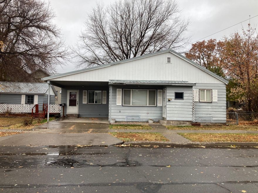 Corner lot at the intersection of Center St and S J St in Lakeview with easy access to shopping, schools and the hospital. This 1736 sqft house is in the process of being remodeled. The kitchen has a garden window, tile flooring, and laminate countertops with tile backsplash. The dining room is the main focus of the house with tile for a woodstove and built-in cabinets. In addition to the living room there is a bonus room with deck right out the sliding glass door. The main bedroom has a very large bathroom with a soaking tub and a full walk-in glass shower. The laundry room could easily be converted to a bedroom by enclosing the washer and dryer area. Single car detached garage.