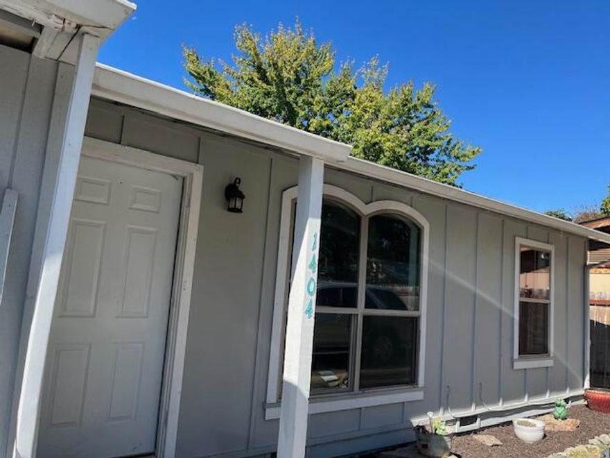 Great Opportunity for first time home buyer or investor. This charming 2 bedrooms and 1 bathroom home is 714 sq ft. Hardwood floors in Living room and bedroom, vinyl floors in kitchen and bathroom. Double pane vinyl windows. Carport Enclosed into an 11x13 Bonus room not included in total sq. ft. Fenced backyard with storage and garden area. Convenient location close to downtown, restaurants and hospital. Come check it out today!