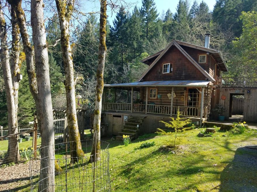 Back on the market no fault of the property. A storybook 2 bd 1ba, cedar cabin snuggled onto 82 secluded acres. Cabin looks over a 1540 sq ft shop with office, multiple entrances and 2 large shop areas for woodworking projects or repair shop. From the covered front porch this amazing property hosts views of the mountains to the south east. Two creeks and teaming with wildlife the house is fenced and cross fenced with a raised garden bed area. Heated and cooled with an energy efficient Daikin ductless system. Also, a cast iron wood burning stove to add to the ambiance. A large deck off of the upper story bedrooms to a separate entrance and stairway. A hidden back yard patio and outdoor shower. A Laundry room, large bath room with shower and tub. A new septic system is being installed for the lucky owners. This is Gated property with a code, not a drive by.